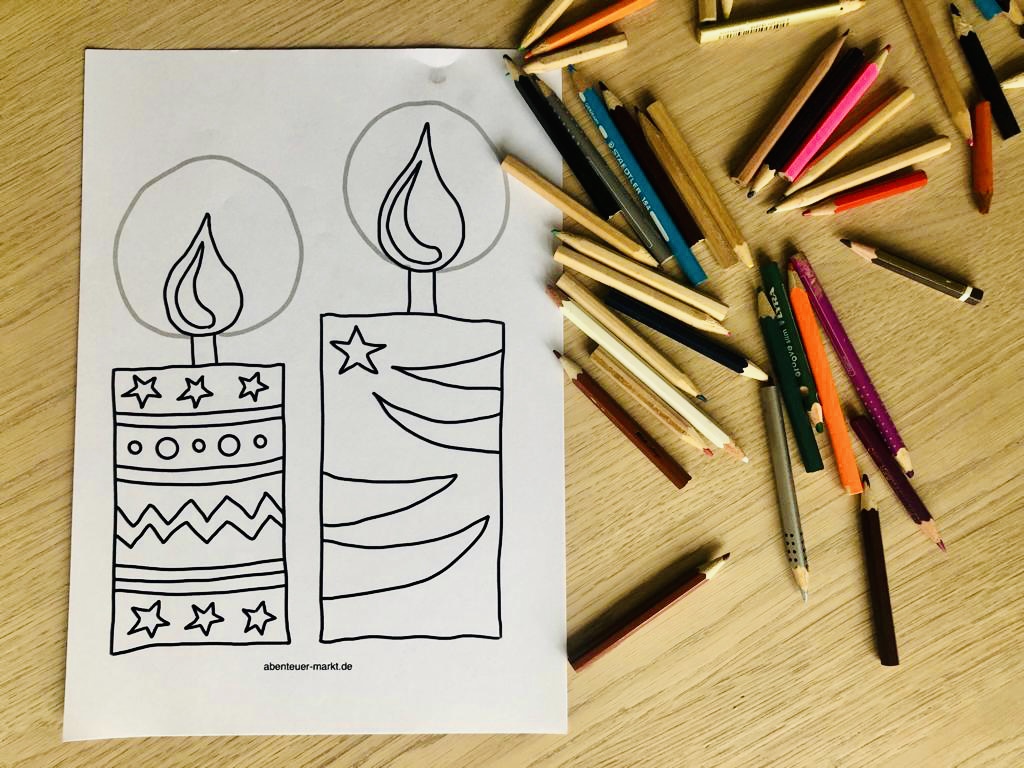 Bild zum Schritt 6 für das Bastel- und DIY-Abenteuer für Kinder: 'Dann malt ihr die Kerzen mit Buntstiften kräftig aus.'
